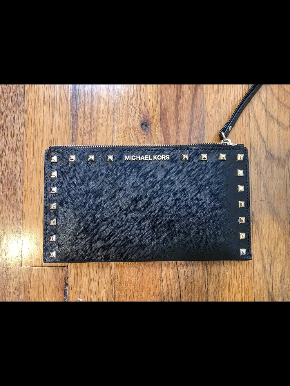 Michael Kors Black Wristlet with Gold Pyramid Studs